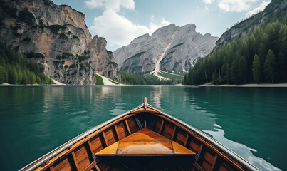 Lago di Braies Alpine Lake with a Canoe on Clear Waters and Mountain Backdrop - obrazy, fototapety, plakaty