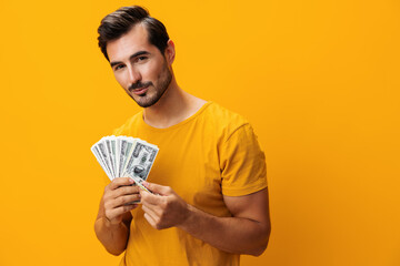 Man smiling cash success background surprised finance dollar money currency happy hand rich yellow...