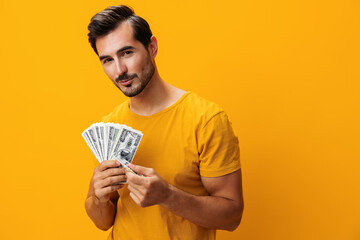 Man smiling cash success background surprised finance dollar money currency happy hand rich yellow business