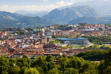 Naklejka na ściany i meble Top view of Oviedo and the mountains in the haze. Oviedo, Asturias, Spain.
