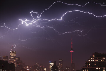 Toronto skyline during a lightning storm at night.
