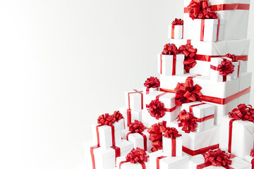 A lot of white gift boxes with red bow on white background decoration