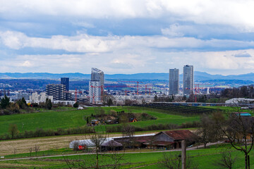 Viewpoint with scenic landscape at Glatt Valley with skyline of City of Stettbach Dübendorf in the background on a cloudy late winter day. Photo taken March 15th, 2024, Zurich, Switzerland.