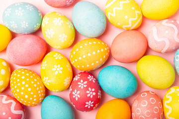 Easter eggs on a bright background. Easter celebration concept. Colorful easter handmade decorated Easter eggs. Place for text. Copy space.