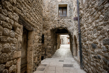 Fototapeta na wymiar a narrow street between stone houses in Montenegro