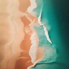 A drone photo of light brown sand and aqua blue water on a coastline