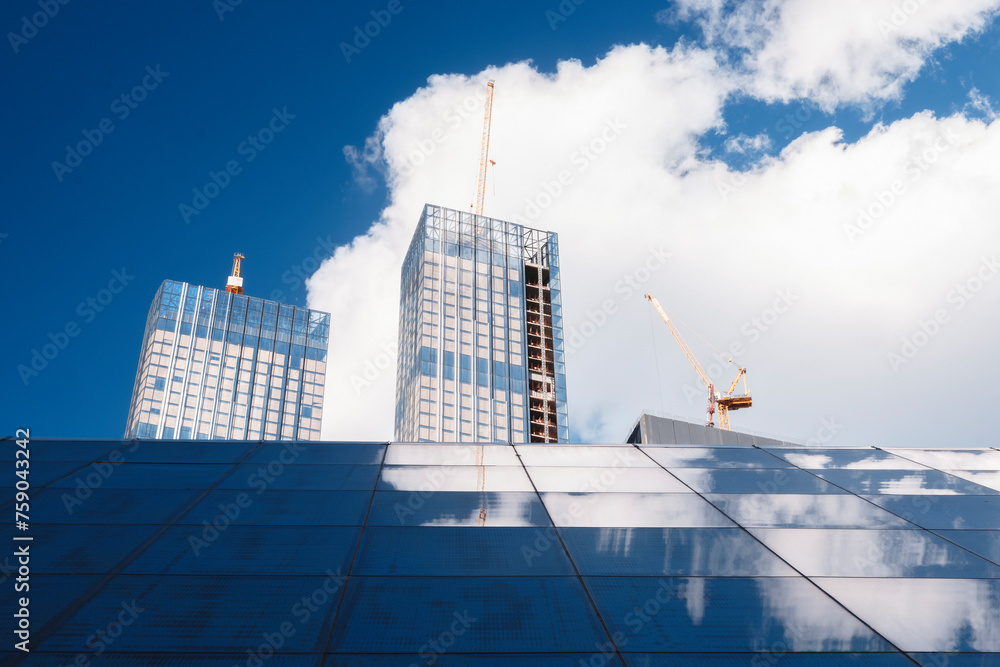 Poster development construction concept background, building a house against a blue sky with clouds and ref