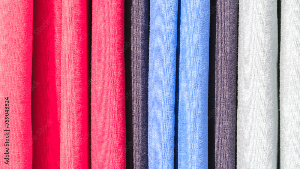 Aufkleber multi-colored textile fabrics hang in a market or store as an abstract background