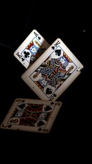 Flying Poker Cards on Black