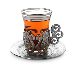 Glass of traditional Turkish tea in vintage holder isolated on white