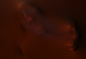 Silhouette of creepy ghost with skulls behind brown cloth
