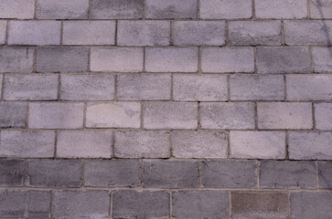a wall of grey concrete blocks