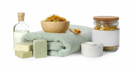 Fototapeta na wymiar Spa composition. Towel, essential oil, soap and dry flowers on white background