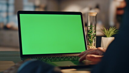 Man hands swiping greenscreen laptop touchpad at office closeup. Manager working