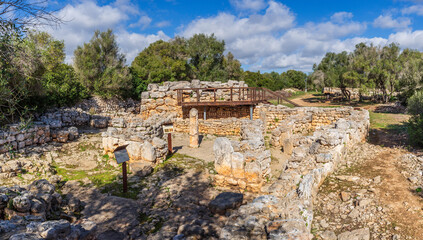 Fototapeta na wymiar talaiot and the semi-detached rooms from the talaiotic era (Iron Age). Hospitalet Vell archeological site, Majorca, Balearic Islands, Spain