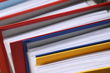 Colorful binder office folders as background, closeup