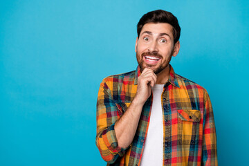 Portrait of toothy beaming guy with stubble wear plaid shirt hold arm on chin demonstrate white...