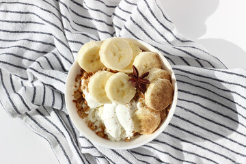 Bowl of Greek Yogurt, Homemade Granola, Served with Banana Slices. Healthy Breakfast Food.