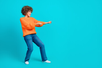 Full length profile photo of hardworking srong woman arms hold pull empty space rope isolated on blue color background