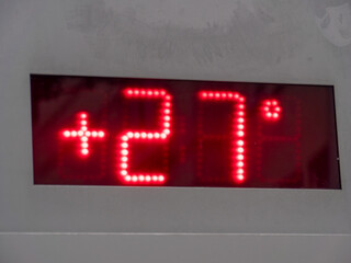 Digital Temperature Display Showing Plus 27 Degrees
