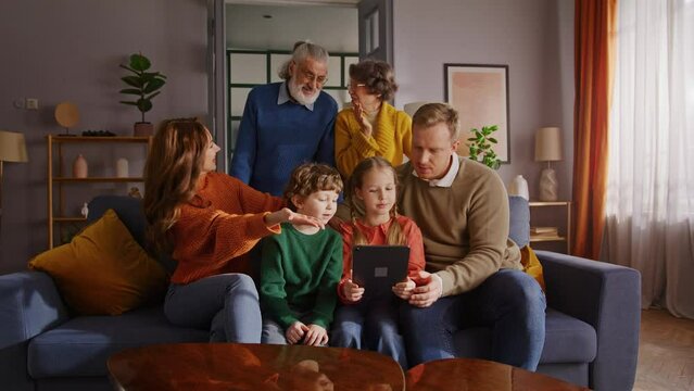 Enthusiastic family using digital tablet for bonding time