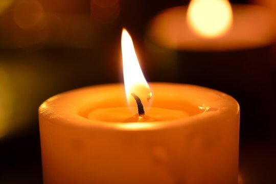 a candle burning down, casting a warm glow
