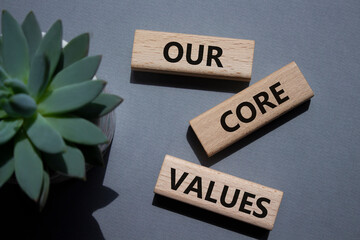 Our core values symbol. Concept words Our core values on wooden blocks. Beautiful grey background...