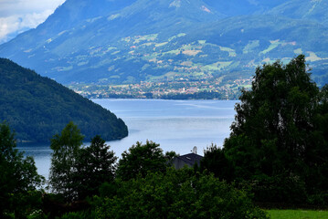 Fototapeta na wymiar Blick auf den Millstätter See mit den Nockbergen im Hintergrund
