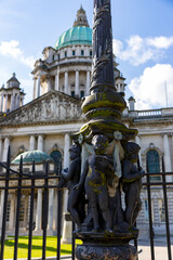 Belfast, Northern Ireland; July 3,2023:  Detail old style street lamps with figures of children outside belfast city hall, UK