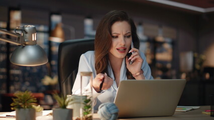 Fototapeta premium Positive manager speaking mobile phone at windows office. Business woman calling