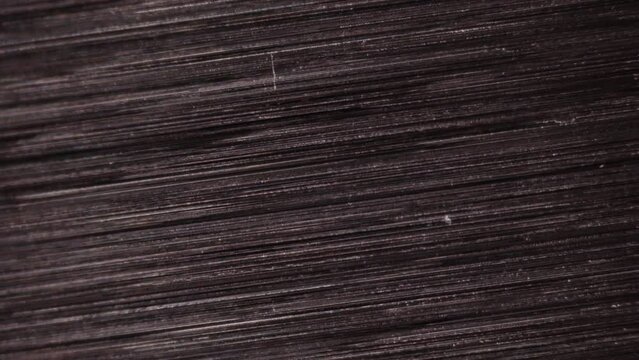 Ultra steel. Special kinds of steel, has high strength, hardness and wear resistance. Surface texture of hi-end steel alloy under microscope. 100x times magnification