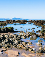 Beach of Ilbarritz with ponds and mountains in the background. Bidart, Basque Country of France. - 759087619