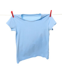 One light blue t-shirt drying on washing line isolated on white