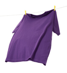 One purple t-shirt drying on washing line isolated on white