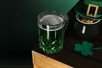 St. Patrick's day celebration. Green beer, leprechaun hat, pot of gold and decorative clover leaf...