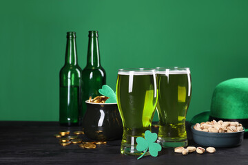 St. Patrick's day party. Green beer, leprechaun hat, pot of gold, pistachios and decorative clover...