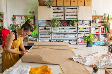 fashion designer draws on paper