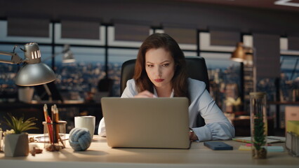 Manager tired work routine at evening office with laptop closeup. Woman reading