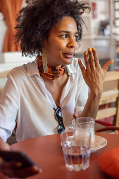 In between candid moment of woman talking