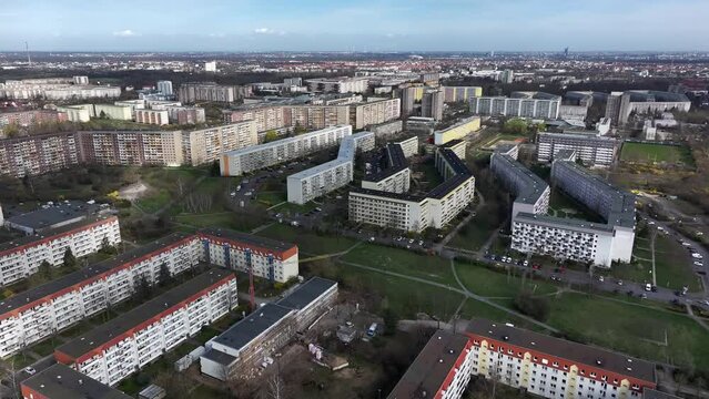 Flight over the Gr&uuml;nau district of Leipzig. Large new development area from the GDR era. Renovated apartment blocks in bright colors. Leipzig city center in the background.