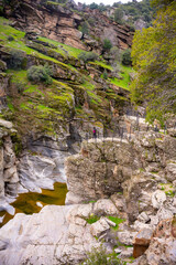 Tasyaran canyon, which attracts attention with its rock shapes similar to Antelope canyon in Arizona, offers a magnificent view to its visitors. Canyon view and stream at sunset. Usak, Turkey.