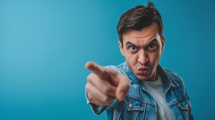 Naklejka premium Man pointing accusingly at viewer.