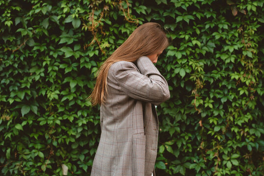 Woman wearing plaid jacket 