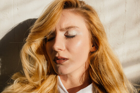 Blonde woman with closed eyes 