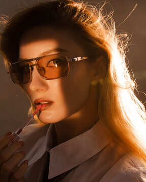 Glamour classy woman with lipstick applicator 