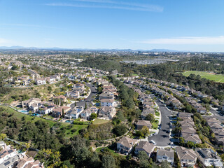 Aerial view of middle class subdivision neighborhood with residential condos and houses in San Diego, California, USA.