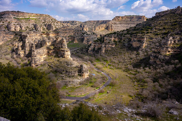 Ulubey Canyon is a nature park in the Ulubey and Karahallı of Usak, Turkey. The park provides suitable habitat for many species of animals and plants and is being developed as a centre for ecotourism.