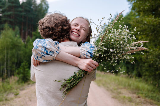 Happy couple hugging in countryside. Love, relationship concept 