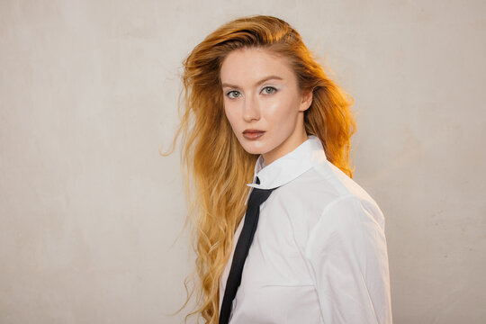 Woman in shirt with tie 