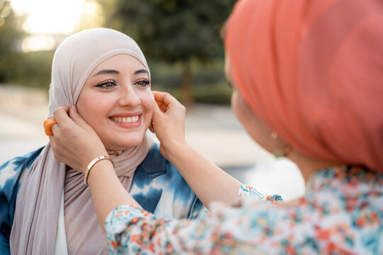 Portrait of glad muslim women friends having fun